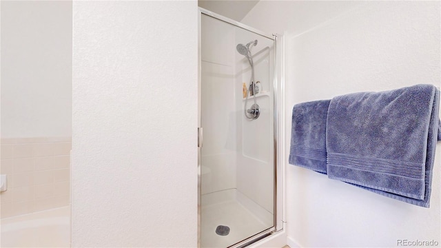 2560 Concord Cir, Lafayette, CO 80026 - full bath with a stall shower and a garden tub