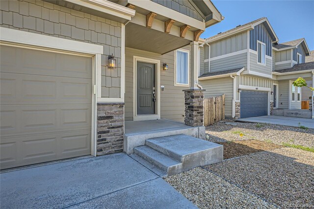 doorway to property with a garage