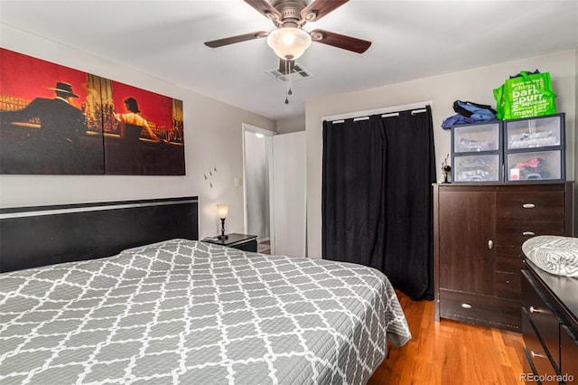 bedroom with ceiling fan and light wood-type flooring