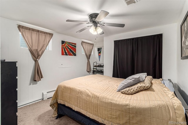 bedroom with a baseboard heating unit, ceiling fan, and carpet floors