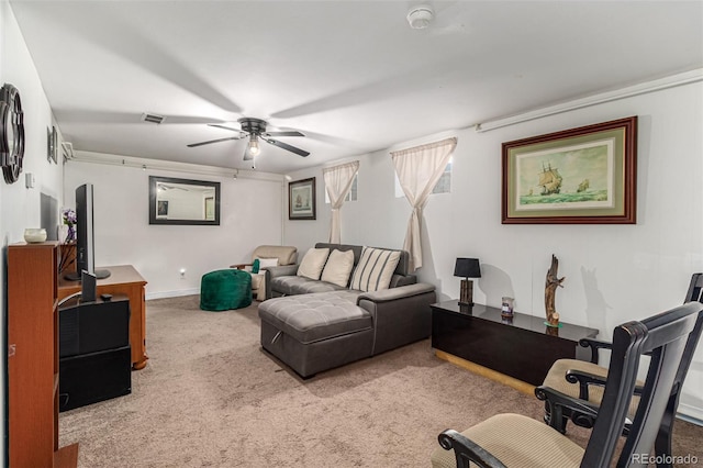 living room featuring ceiling fan and light colored carpet