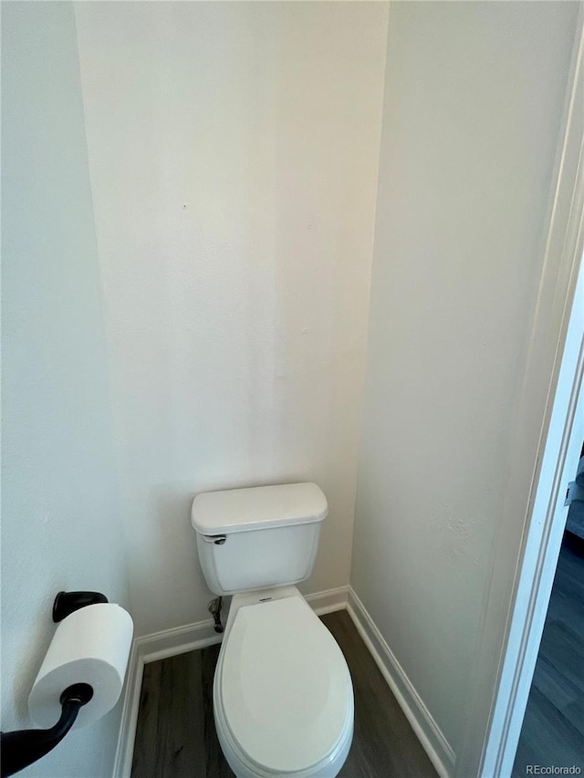 bathroom featuring toilet and hardwood / wood-style floors