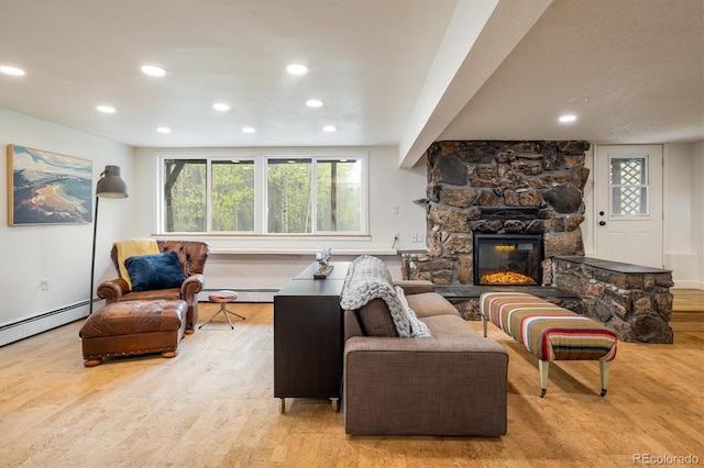 1194 Camp Eden Rd, Golden, CO 80403 - living area with wood finished floors, baseboard heating, recessed lighting, a fireplace, and baseboards