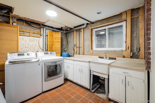 1194 Camp Eden Rd, Golden, CO 80403 - laundry area featuring washer and clothes dryer, cabinet space, and dark tile patterned flooring