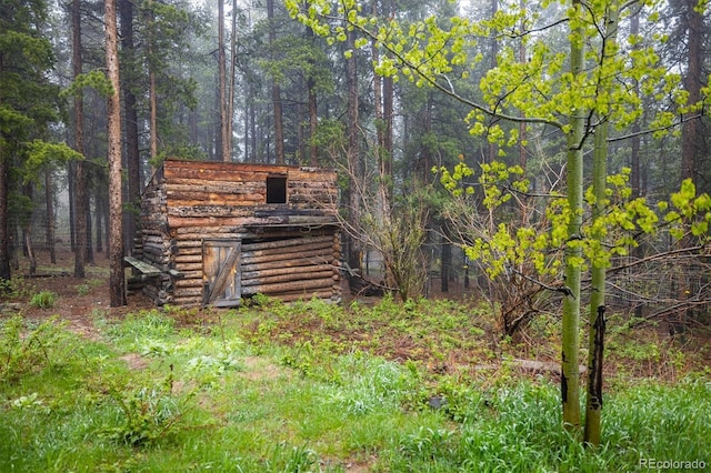 1194 Camp Eden Rd, Golden, CO 80403 - view of outbuilding featuring a wooded view