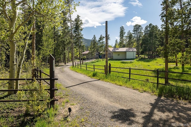 1194 Camp Eden Rd, Golden, CO 80403 - view of dirt / gravel driveway with a gated entry