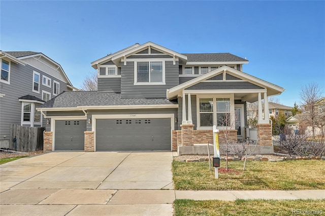craftsman-style home featuring fence, a garage, concrete driveway, brick siding, and roof with shingles