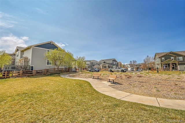 view of yard featuring a residential view and fence