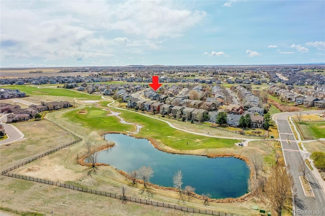 drone / aerial view featuring a residential view and a water view