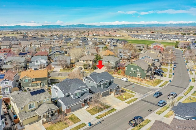 birds eye view of property featuring a residential view and a mountain view