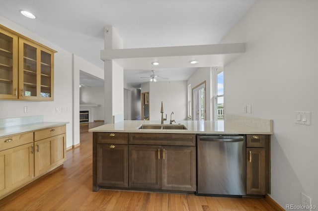 32501 E 137th Way, Brighton, CO 80603 - kitchen featuring dishwasher, a sink, a peninsula, light wood-style flooring, and ceiling fan