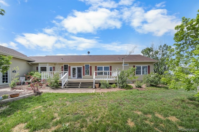 32501 E 137th Way, Brighton, CO 80603 - back of property with a lawn and a deck