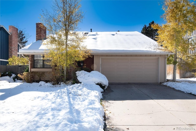 ranch-style home featuring a garage