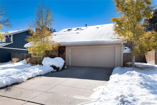 single story home featuring a garage