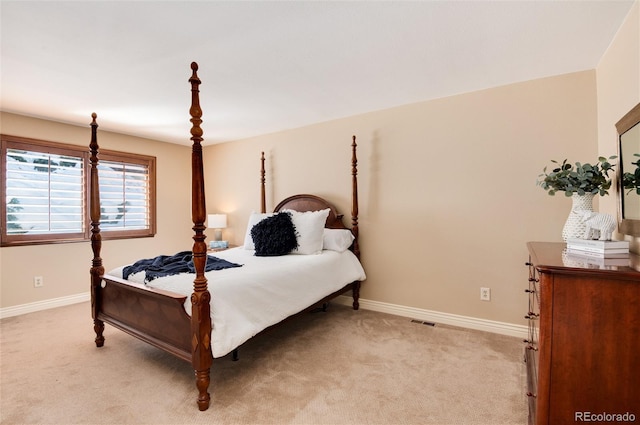 bedroom with light colored carpet