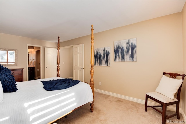 carpeted bedroom with ensuite bathroom