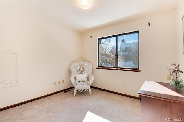 unfurnished room with light colored carpet