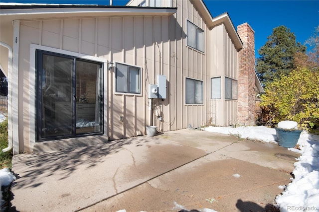 view of side of property with a patio area