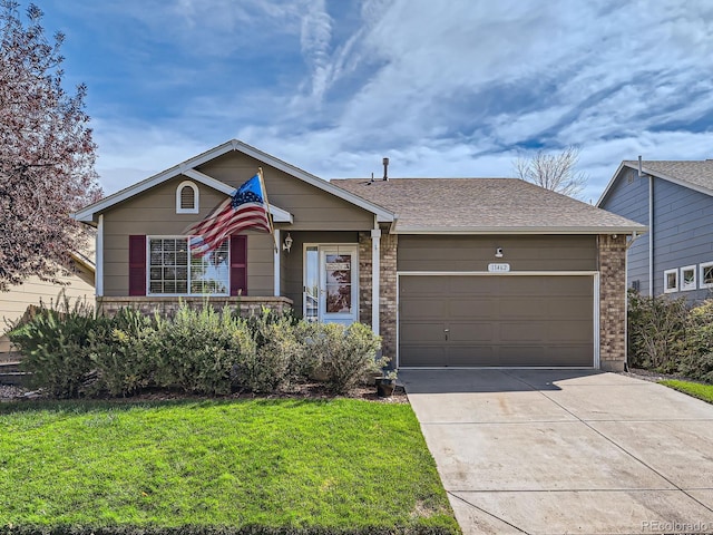 ranch-style home with a front lawn and a garage