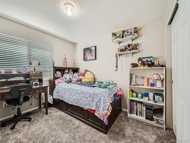 carpeted bedroom featuring a closet