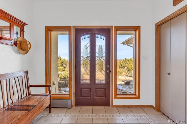 tiled foyer featuring a healthy amount of sunlight