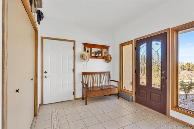 entrance foyer with light tile patterned floors