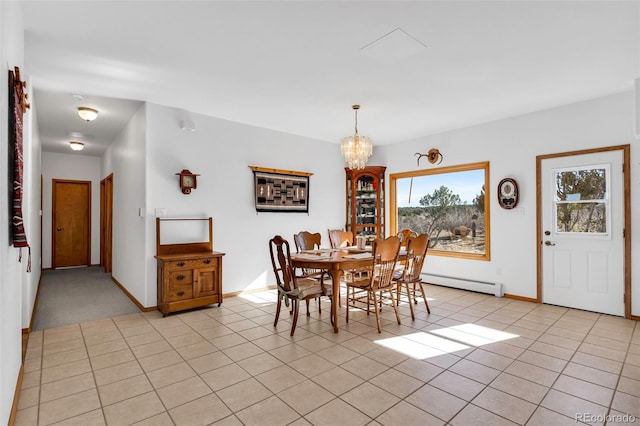 tiled dining room with a chandelier and a baseboard radiator