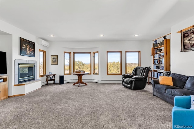 living room with carpet flooring, a wall mounted AC, and a tiled fireplace