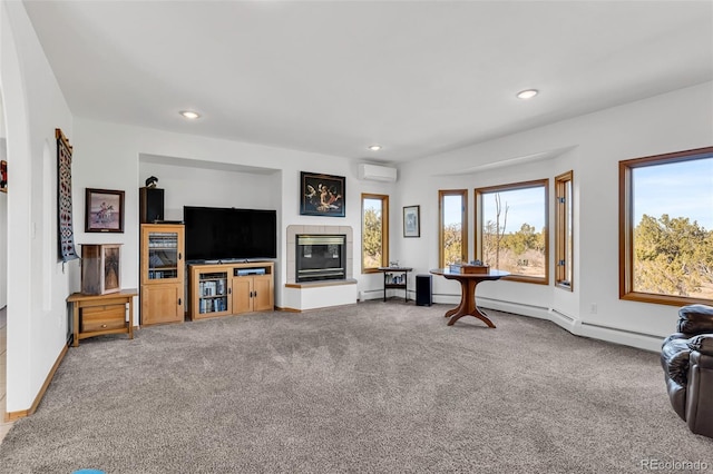 carpeted living room with an AC wall unit