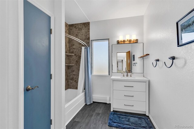 bathroom featuring hardwood / wood-style floors, vanity, and shower / tub combo with curtain