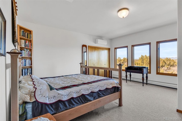 carpeted bedroom with a wall unit AC and a baseboard radiator