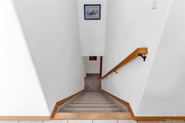 stairs with tile patterned flooring