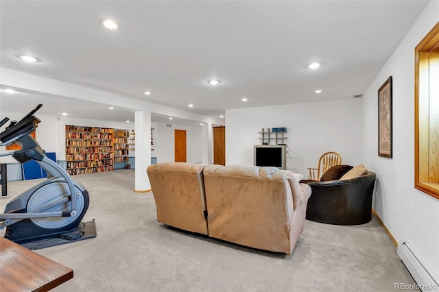 living room with light carpet and a baseboard heating unit