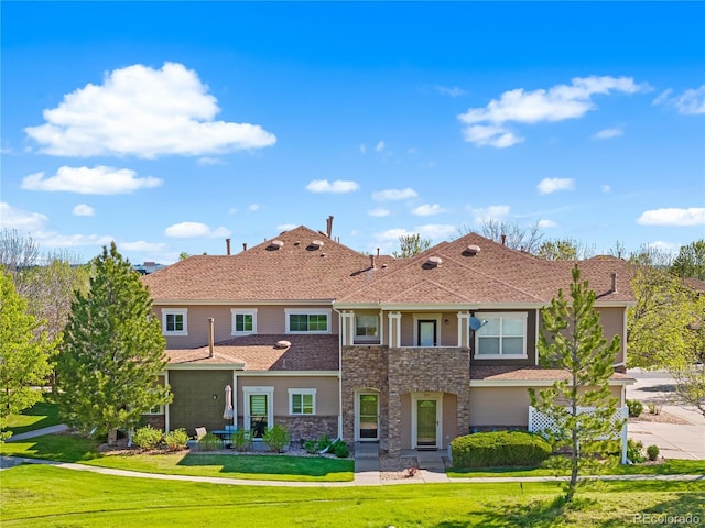 6202 Kilmer Loop Unit 202, Golden, CO 80403 - view of front of property with stone siding, a front lawn, and roof with shingles