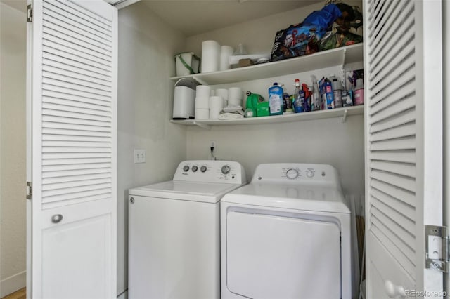 laundry area with washing machine and clothes dryer