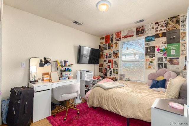 bedroom featuring hardwood / wood-style floors