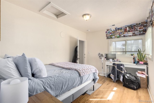 bedroom with light wood-type flooring