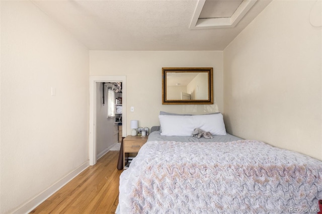 bedroom with light wood-type flooring