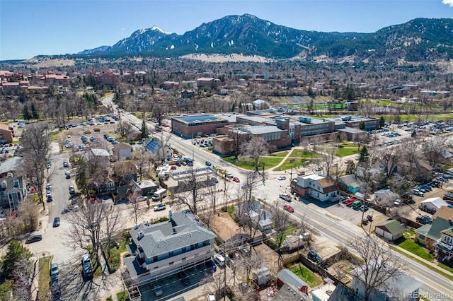 birds eye view of property featuring a mountain view