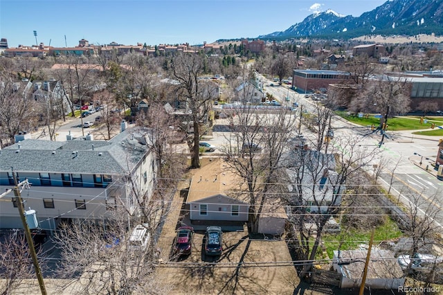 birds eye view of property featuring a mountain view