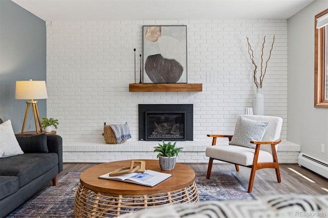 1931 Foothills Rd, Golden, CO 80401 - living room with wood finished floors, a fireplace, and a baseboard radiator