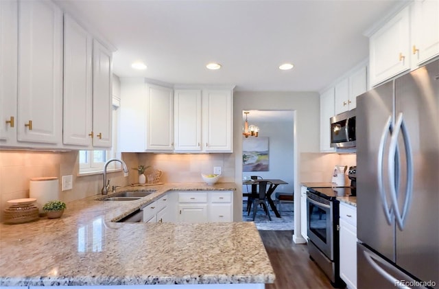 1931 Foothills Rd, Golden, CO 80401 - kitchen with appliances with stainless steel finishes, a sink, white cabinetry, and recessed lighting