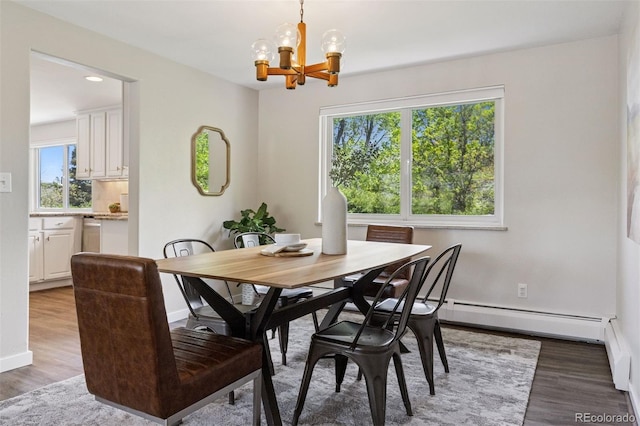 1931 Foothills Rd, Golden, CO 80401 - dining space featuring a chandelier, wood finished floors, a baseboard radiator, baseboards, and recessed lighting