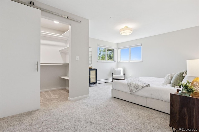 1931 Foothills Rd, Golden, CO 80401 - carpeted bedroom with a walk in closet, a baseboard radiator, and baseboards