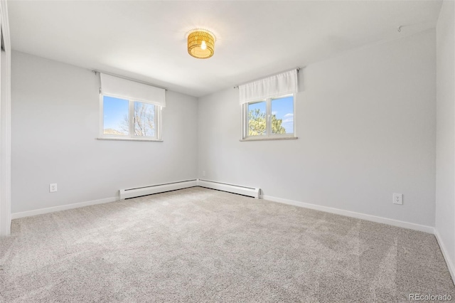 1931 Foothills Rd, Golden, CO 80401 - empty room with plenty of natural light, carpet floors, baseboards, and a baseboard heating unit