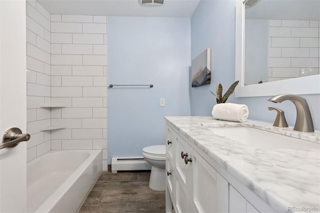 1931 Foothills Rd, Golden, CO 80401 - bathroom with a baseboard heating unit, vanity, wood finished floors, toilet, and shower / bath combination