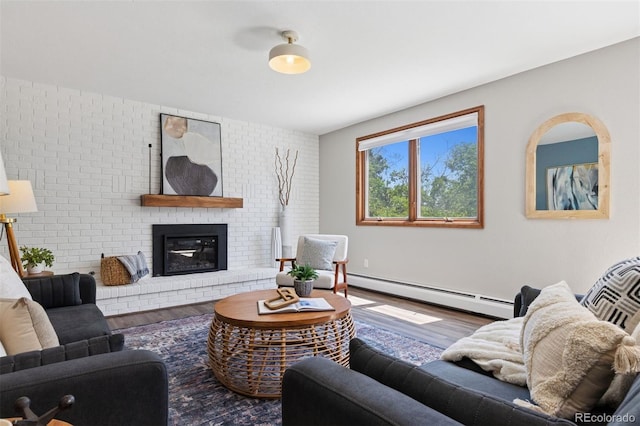 1931 Foothills Rd, Golden, CO 80401 - living room with a baseboard heating unit, wood finished floors, and a fireplace