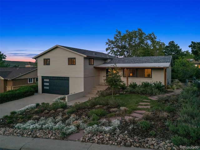1931 Foothills Rd, Golden, CO 80401 - split level home with concrete driveway and a garage