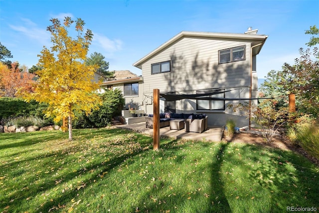 1931 Foothills Rd, Golden, CO 80401 - rear view of house featuring an outdoor hangout area, a yard, a chimney, and a patio