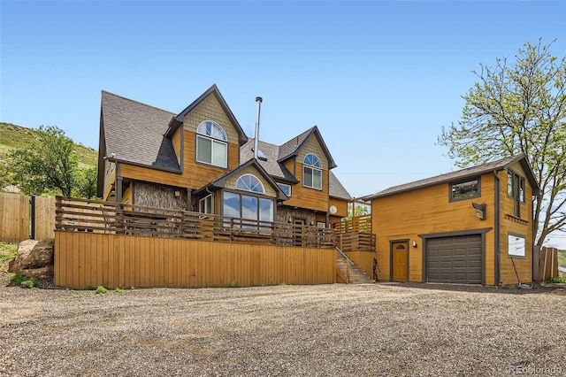 220 Wark Ave, Berthoud, CO 80513 - chalet / cabin featuring driveway, stairway, an attached garage, and a shingled roof
